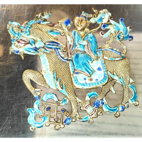 454 - A Chinese white metal dragon pendant with blue enamel decoration to both sides, length 9cm