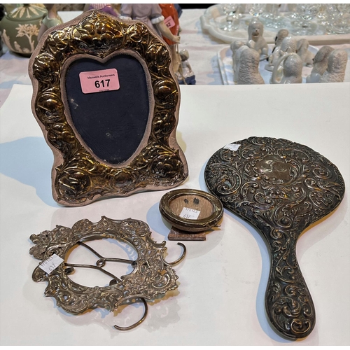 617 - A hallmarked silver heart shaped photo frame; a hallmarked silver embossed hand mirror; etc., variou... 