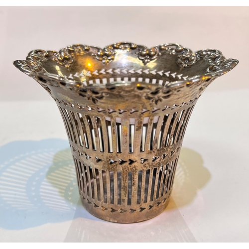 620 - A hallmarked silver pierced vase holder of flared form, with scroll border, Chester 1902, 6.5oz