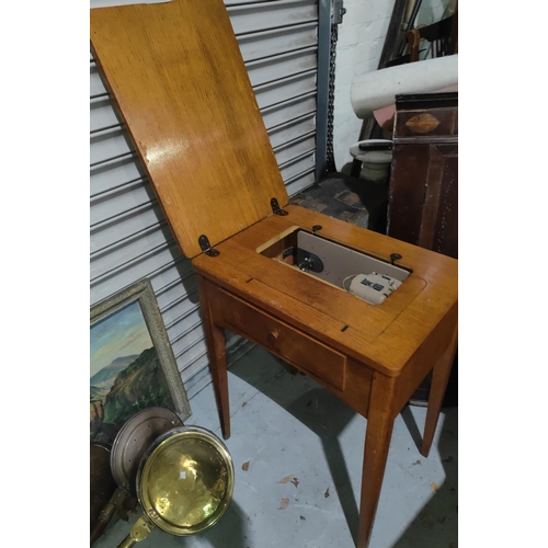 1048 - A light oak sewing table with singer machine to the interior