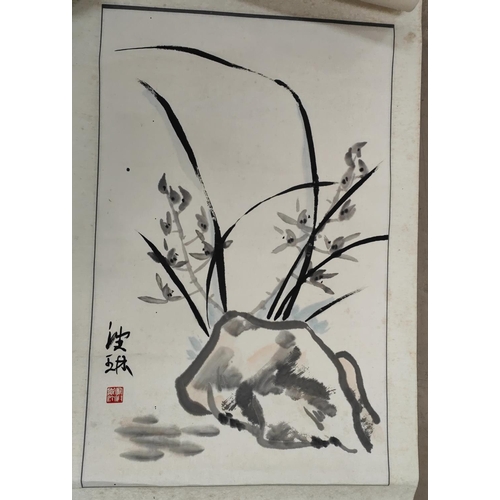 437A - A Chinese scroll painting of a rock decorated with flowers, seal signature