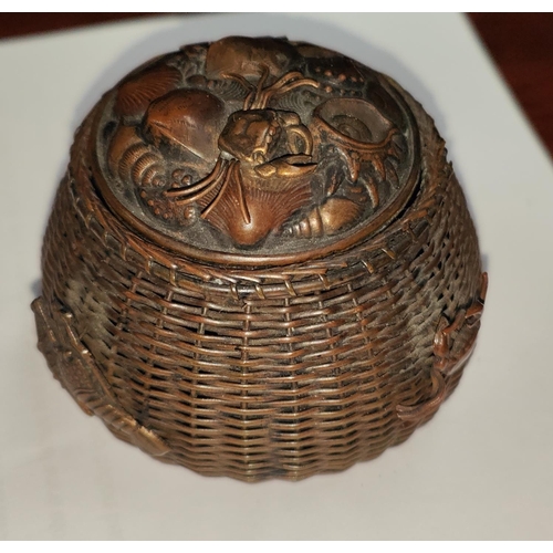 457A - A Japanese copper ink well in the form of a fisherman's basket with various creatures in relief, gla... 