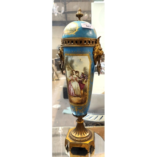 587 - A 19th century Sèvres covered vase with gilt interior and gilt animal head fittings, panel de... 