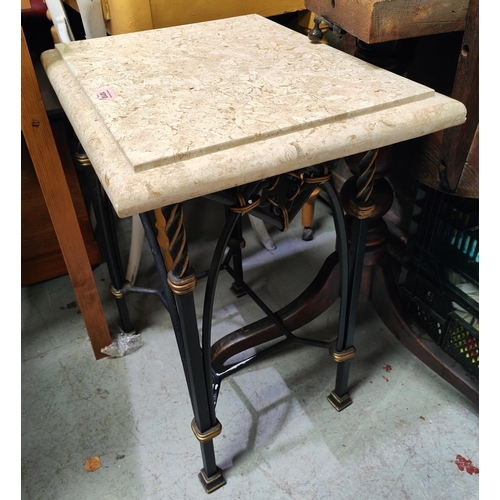 1010 - An occasional table with heavy marble top on gilt and japanned metal base