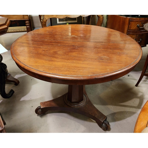 1011A - A circular mahogany supper table with column base