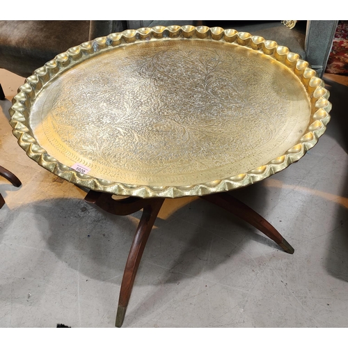 1020 - A brass Middle Eastern table with stylish mid century style base