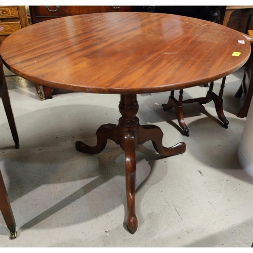 1024 - A 19th century mahogany tilt top supper table on 3 feet, turned column with good sized top, 91cm