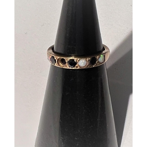 686 - A 9 carat hallmarked gold half eternity ring set 3 sapphires and 4 opals (1 opal missing), 2gm