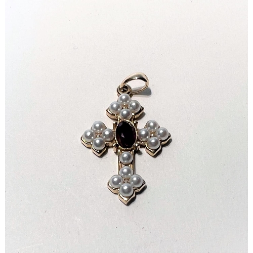 752J - A 9ct gold garnet and pearl set cross in the antique manner