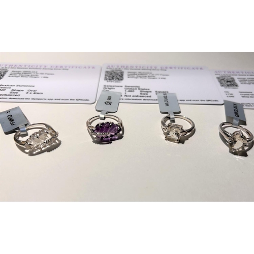 790 - Four hallmarked silver dress rings:- 1 set crystal quartz and white zircon; 1 set Mexican Sunstone; ... 