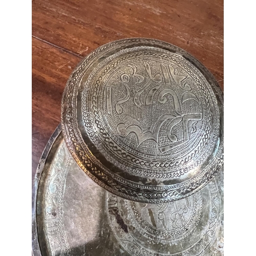 829C - A Middle Eastern white metal dish and a similar lidded pot