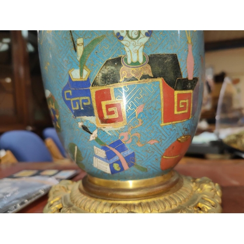 446 - A Chinese cloisonne blue ground vase with bras foot and rim, decorated with vases etc, height 32cm