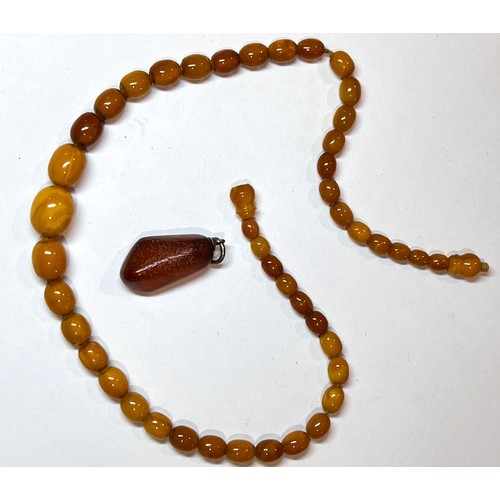 752M - A butterscotch amber lady's necklace and separate pendant.  Weight 14.2gms.