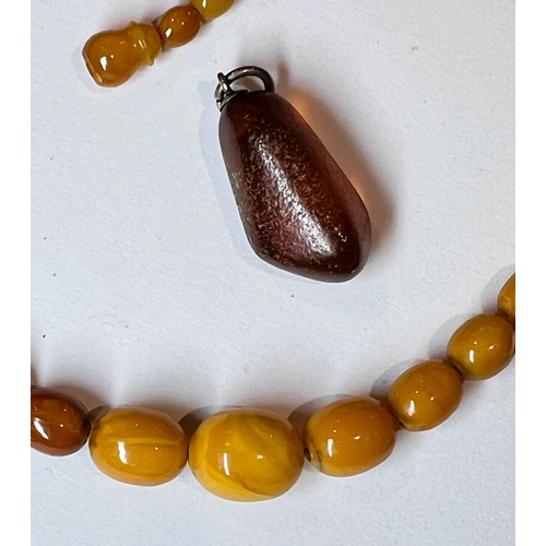 752M - A butterscotch amber lady's necklace and separate pendant.  Weight 14.2gms.