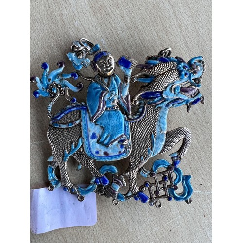 454 - A Chinese white metal dragon pendant with blue enamel decoration to both sides, length 9cm