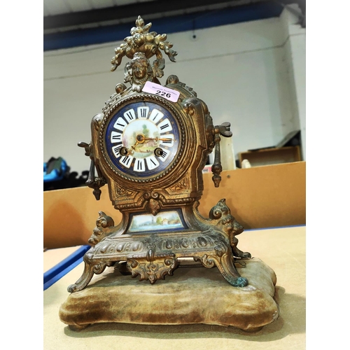 72 - A 19th century French gilt mantel clock with painted porcelain dial, height 30cm