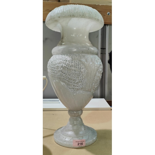 71 - An alabaster carved urn/ vase with decoration, height 42cm