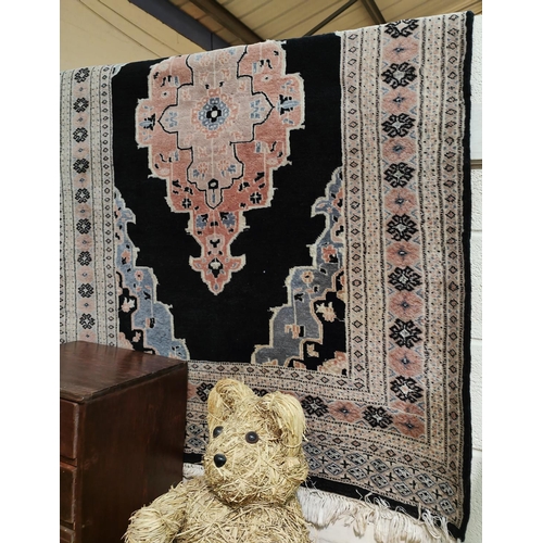 846 - A Chinese black ground carpet, width 123cm.