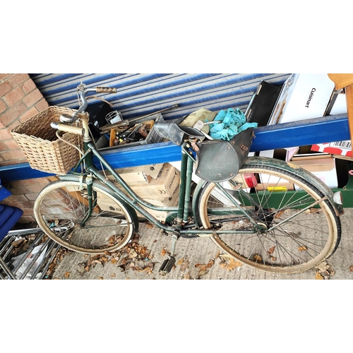 21B - A vintage bicycle in green with basket to front