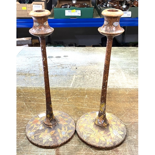 340A - A pair of WWII Japanese prisoner of war carved and decorated candlesticks