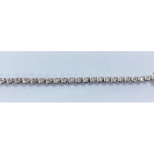 716A - A 9 carat white gold ‘Tennis Bracelet’ set 42 diamonds (approximately 2 - 3 carats, each... 