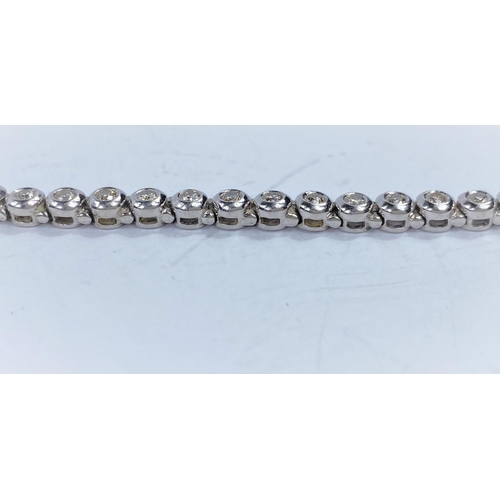 716A - A 9 carat white gold ‘Tennis Bracelet’ set 42 diamonds (approximately 2 - 3 carats, each... 