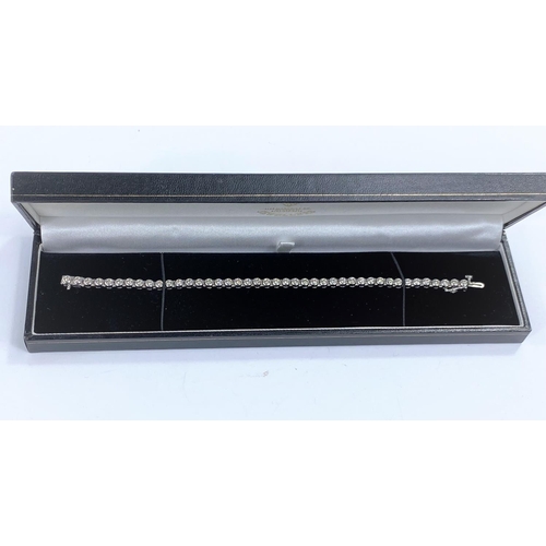 716A - A 9 carat white gold ‘Tennis Bracelet’ set 42 diamonds (approximately 2 - 3 carats, each... 