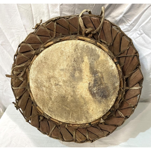 18 - An early to mid 20th century African style tribal drum with interlinking wooden sections, with hide ... 