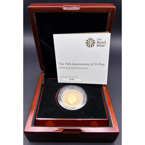 244 - A 2019 75th anniversary of D-Day, gold proof £2 coin with C.O.A and boxed