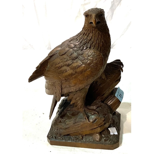 31 - A Black Forest style carved wood eagle, height 27cm; a selection of vintage OS & Bartholomew map... 