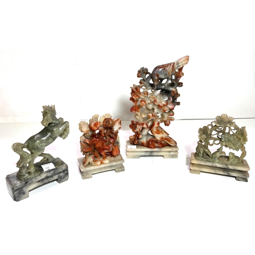 395 - 4 green/brown soapstone carvings, bird in a tree 22cm; rearing horse height 12cm; birds on fruiting ... 