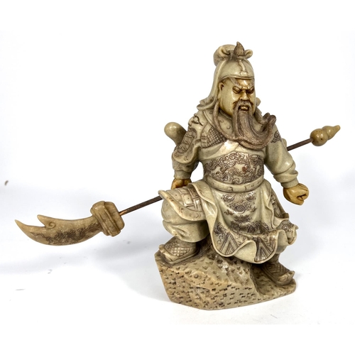 400 - A carved ivory coloured soapstone depicting a Chinese General with lance height 21cm