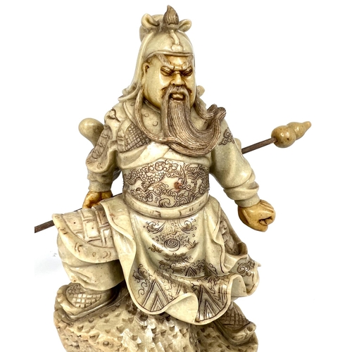 400 - A carved ivory coloured soapstone depicting a Chinese General with lance height 21cm