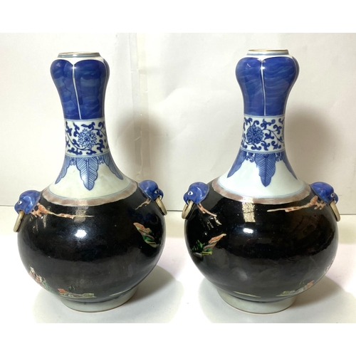 415 - A pair of Chinese Famille Noir vases with blue and white highlights, traditional scenes with 6 chara... 