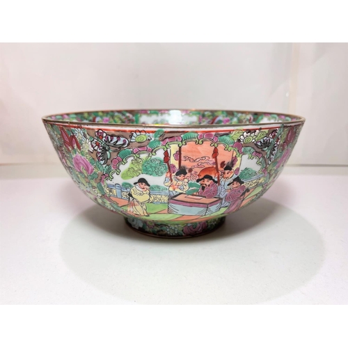 420A - A Chinese famille vert bowl decorated with traditional scenes of figures and flowers, diameter 25.5c... 