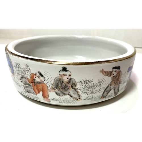 424 - A Chinese Republic period shallow bowl decorated in polychrome with children exercising, orange seal... 