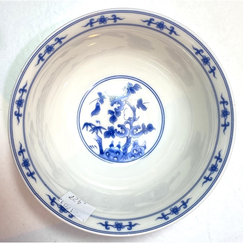 427 - A modern Chinese blue & white teapot with inset rice grains; a modern rice bowl decorated in pol... 