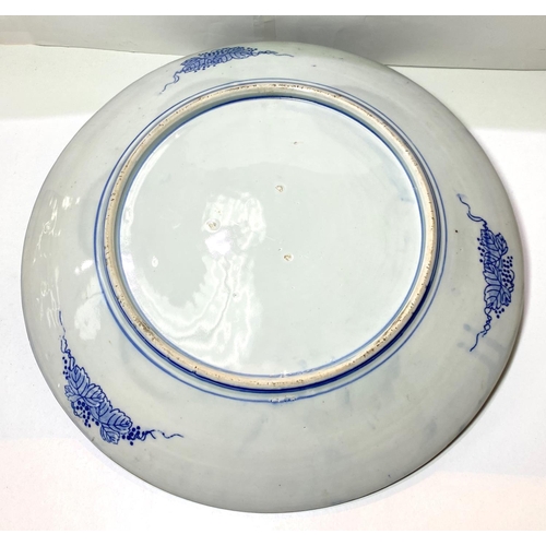 429 - A Chinese blue and white charger decorated with five clawed dragon circling mythical bird, 47cm