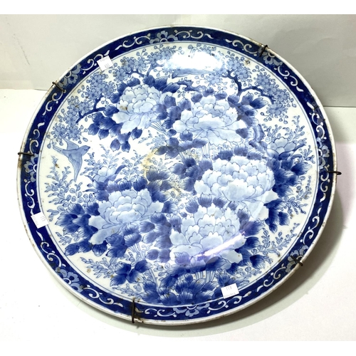 431 - A large 19th/20th century Japanese blue and white charger decorated with birds and flowers, diameter... 