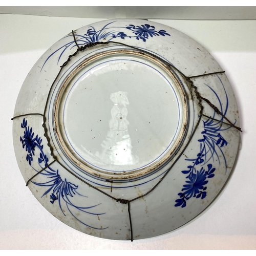 431 - A large 19th/20th century Japanese blue and white charger decorated with birds and flowers, diameter... 