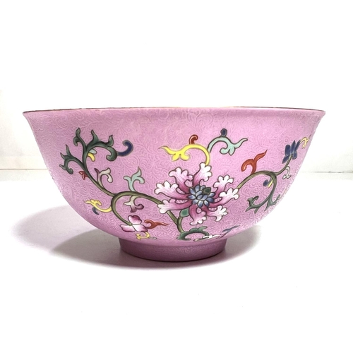 437 - A Chinese famille rose bowl with swirling incised decoration with polychrome flowers and seal mark t... 