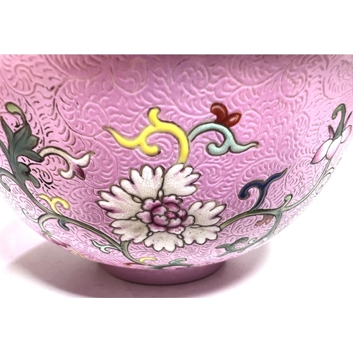 437 - A Chinese famille rose bowl with swirling incised decoration with polychrome flowers and seal mark t... 