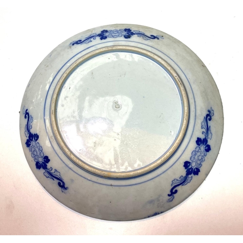 438 - A late 19th/early 20th century Japanese wall plaque in blue and white willow pattern, diameter 30cm;... 