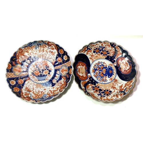 444 - Two Imari circular wall plaques with scalloped borders, diameter 31cm