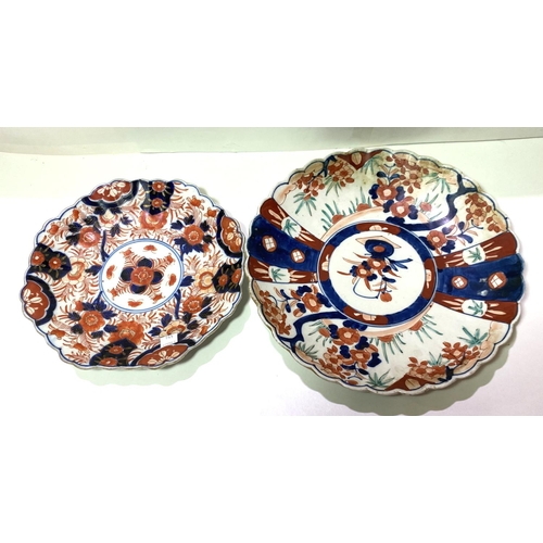 446 - Two Imari circular wall plaques with scalloped borders, diameters 30 & 25cm