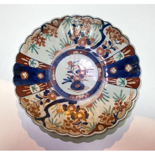 446 - Two Imari circular wall plaques with scalloped borders, diameters 30 & 25cm