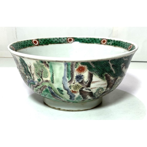 451 - A Chinese bowl decorated with Chinese characters, oxen & farmer, 20cm diameter.