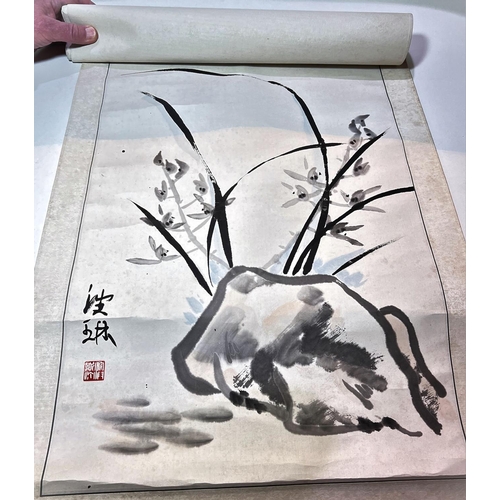 456 - A Chinese scroll painting of a rock decorated with flowers, seal signature