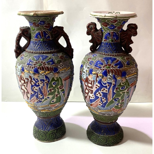 461 - A pair of late Satsuma baluster vases decorated with figures in green, blue and red (1 rim repaired)... 