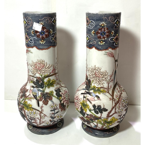 461 - A pair of late Satsuma baluster vases decorated with figures in green, blue and red (1 rim repaired)... 